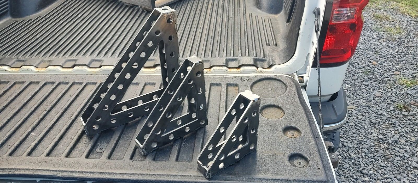 Three sizes of laser-cut steel welding squares